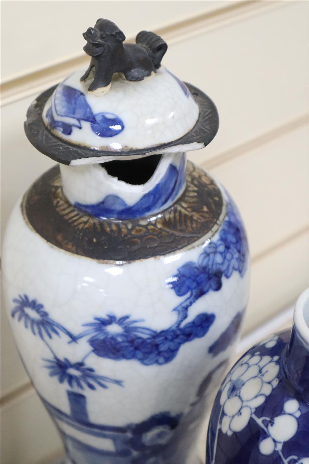 A graduated set of three Chinese porcelain blue and white bowls, largest 19cm and a group of four miniature Chinese blue and white vase